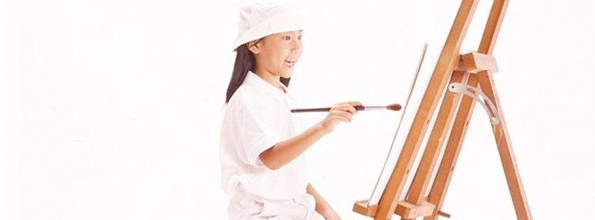 Child painting canvas.