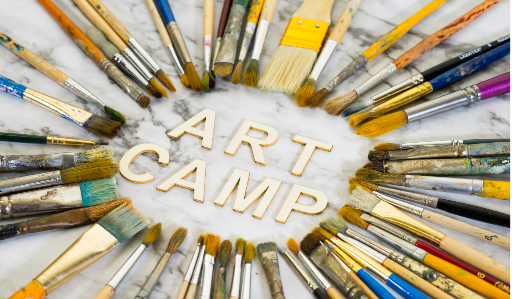 "Art Camp" surrounded by paint brushes.