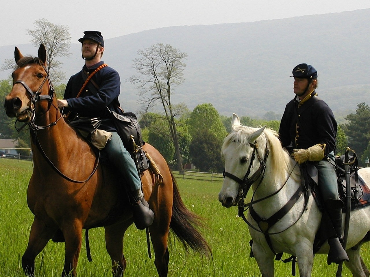 two civil war era soldiers on horses