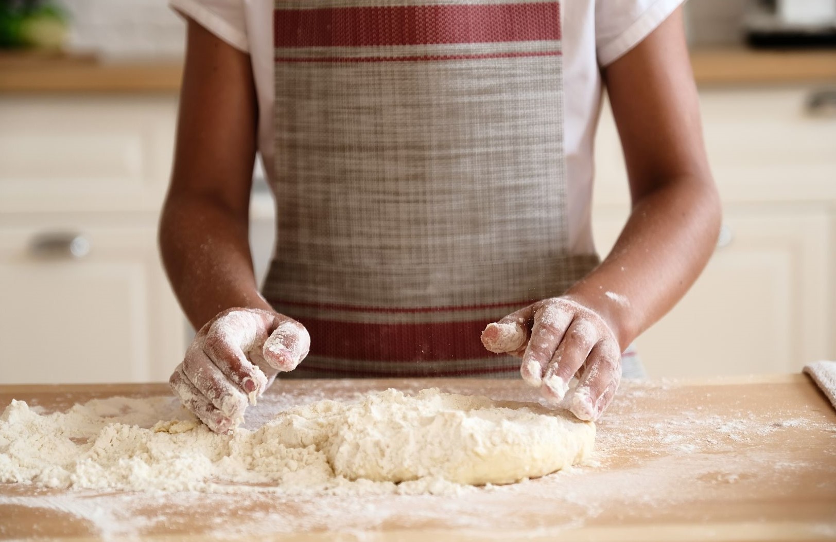Tween making dough.