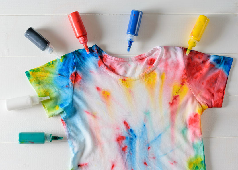 Tie dyed t-shirt with ink bottles.