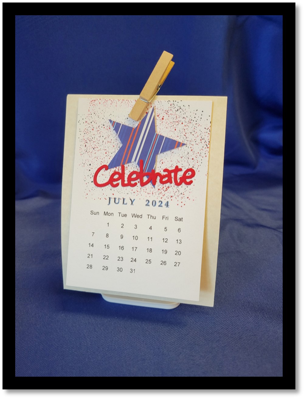 Sample of a calendar for July 2024 with a star and the word Celebrate