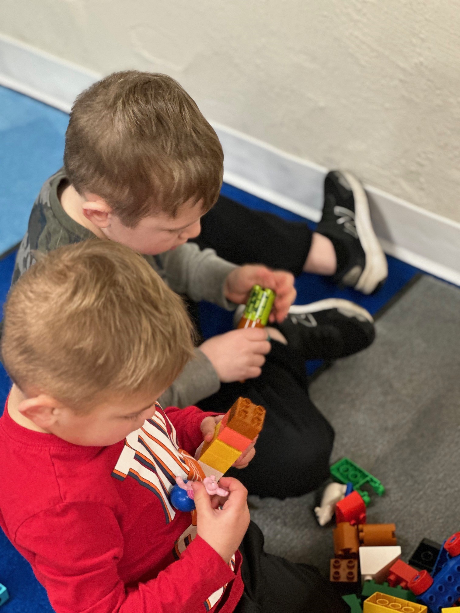 Children building with blocks during story time 