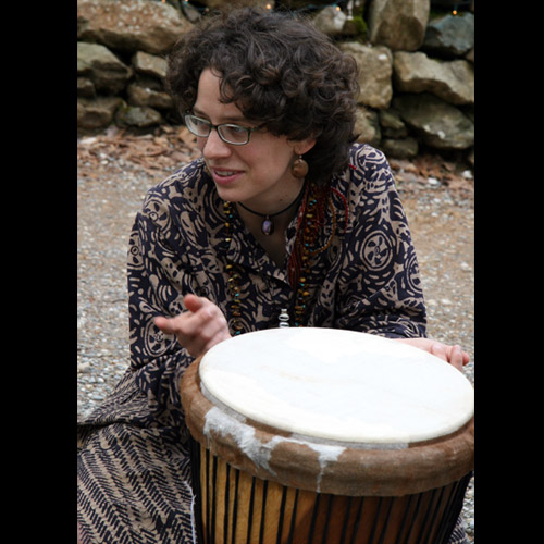 Photo of women with drum that has white top