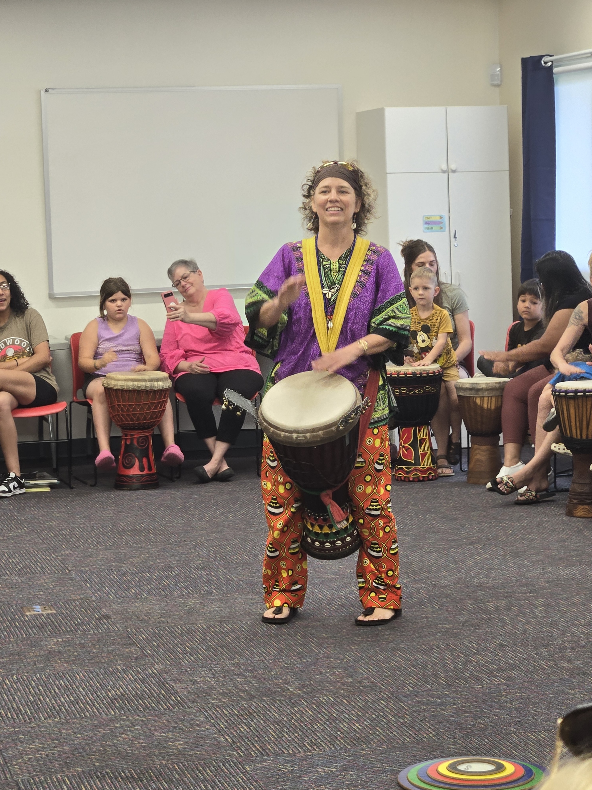 woman playing a drum