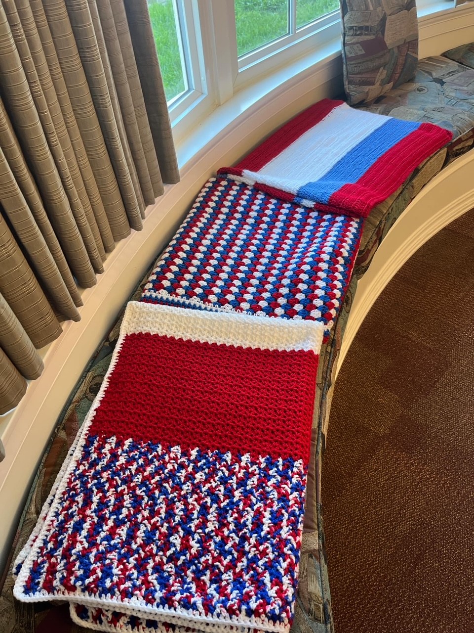 photo of red white and blue crocheted blankets