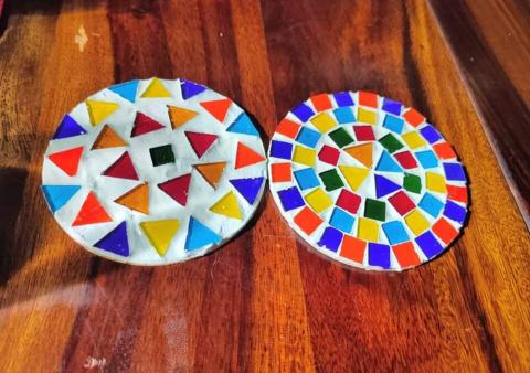 Two mosaic coasters.