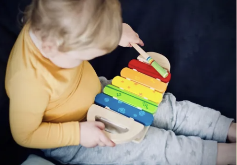 baby with xylophone toy