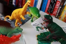 dinosaurs reading the very hungry caterpillar