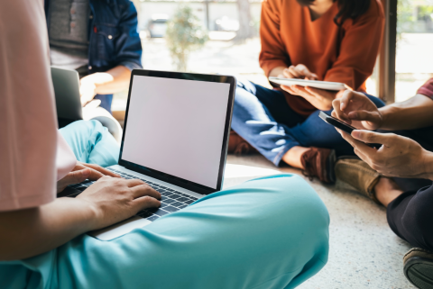 Teens with laptop.