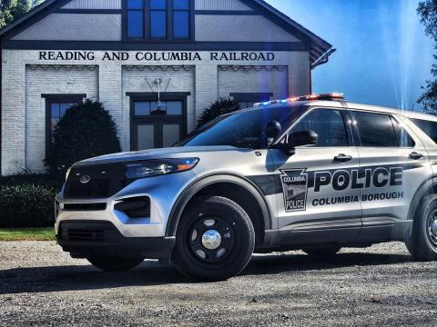 Photo of a gray and black police cruiser 
