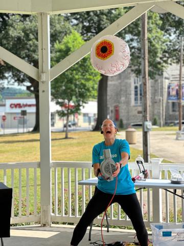 Photo of presenter doing a science experiment 