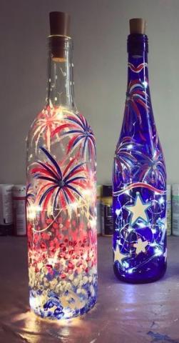 painted glass bottles with lights inside