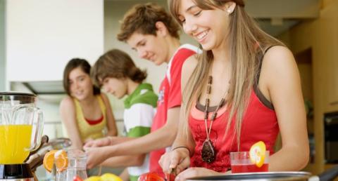 Teens cooking.