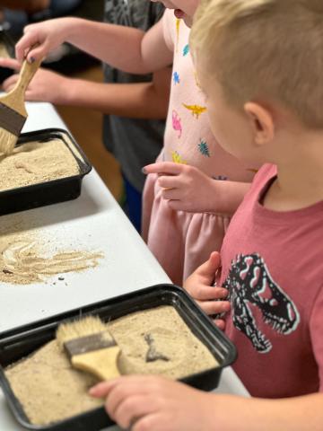 Child digging for dinosaur bones