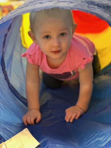 Child crawling through tunnel