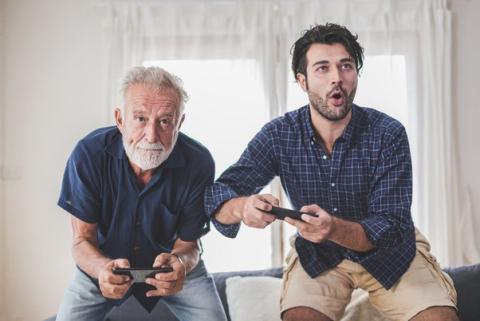 Adults playing a video game.