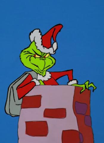 The Grinch dressed as Santa in chimney.