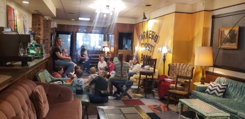 adults and children at story time