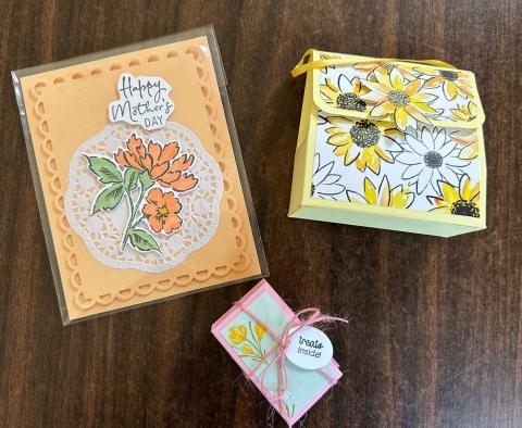 Photo of 1 orange card and two treat boxes