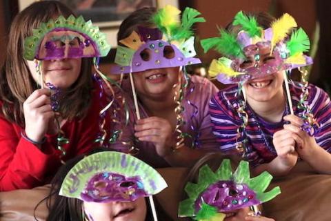 Kids in Mardi Gras masks.