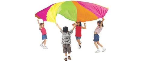 Children playing with a parachute. 