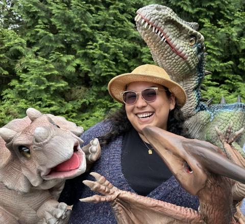 Women with dinosaurs
