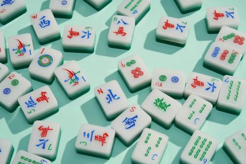 mahjong tiles on a blue background