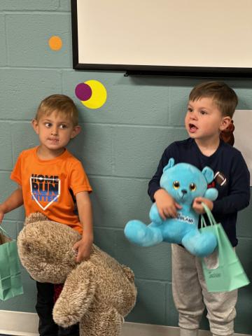 Two Children with teddy bears during story time