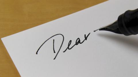 "Dear" written on page.