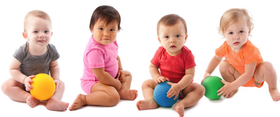 Babies in colorful onsies with colorful balls.