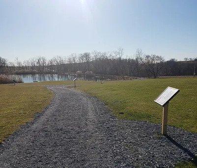 Story post and path at the park.