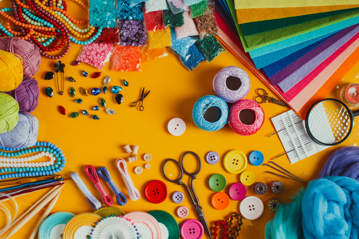 Crafting supplies on a yellow background.