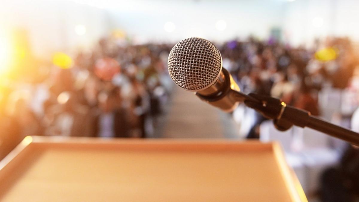 Forced perspective of standing at a podium overlooking a crowd.