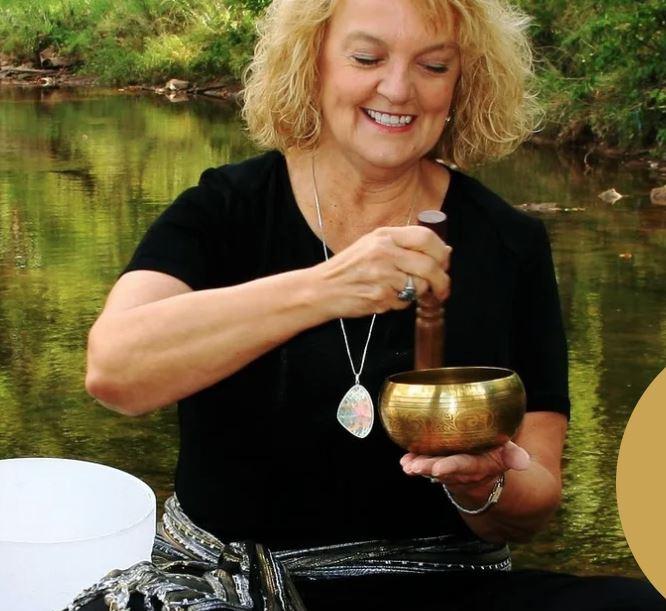 woman using a metal singing bowl