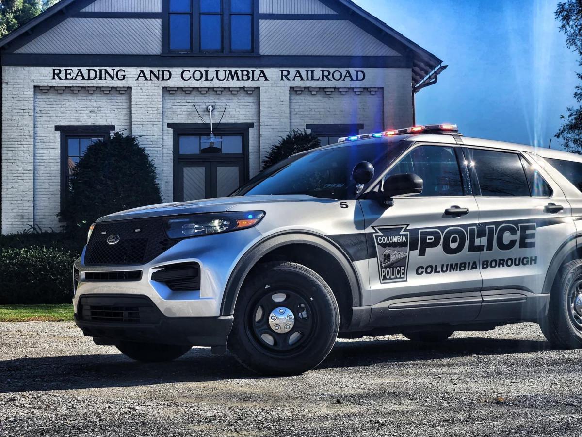 Photo of a gray and black police cruiser 