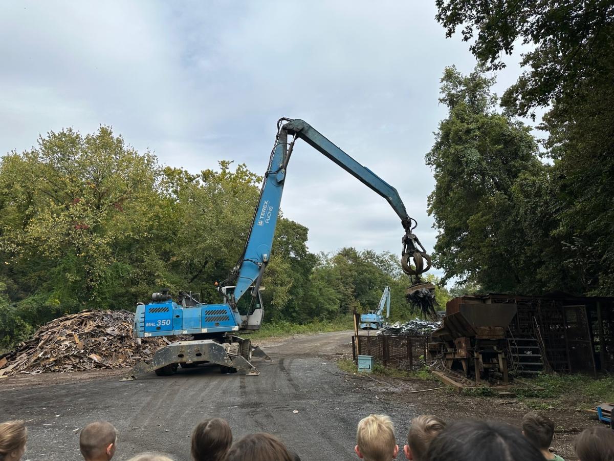 Photo of blue crane moving metal