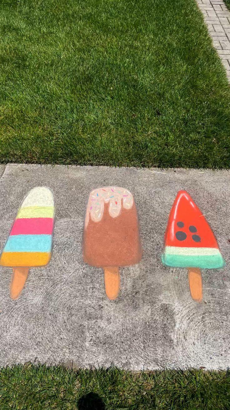 Sidewalk chalk art of popsicles.