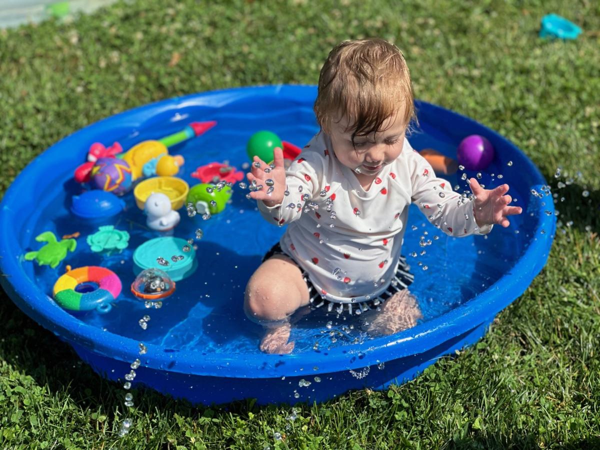 Child playing in pool during Water Play