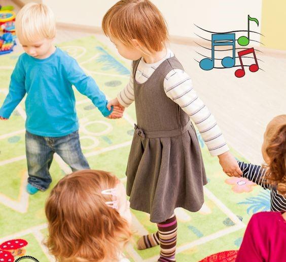 children holding hands dancing