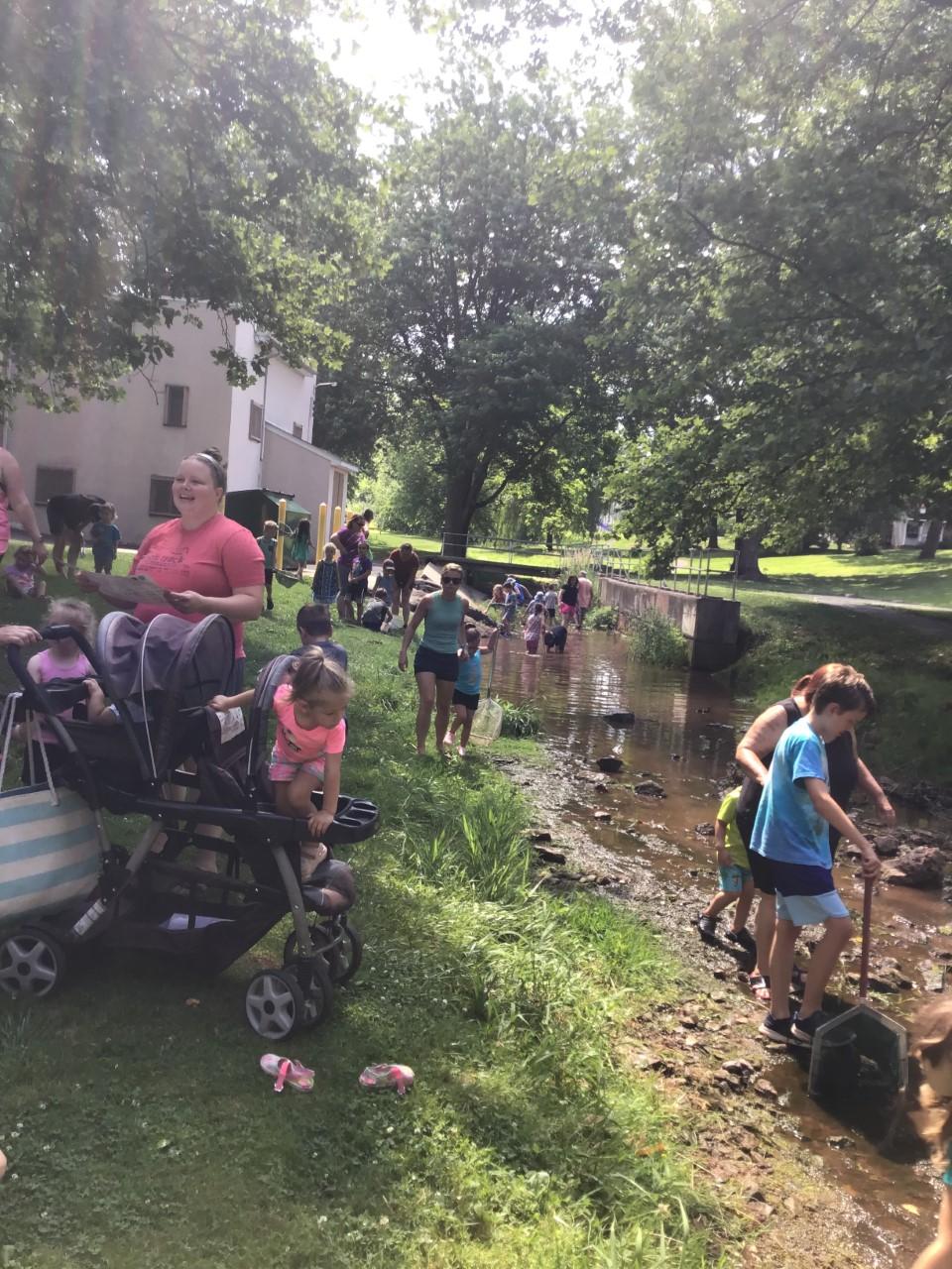 image of people by the stream at the last year's event