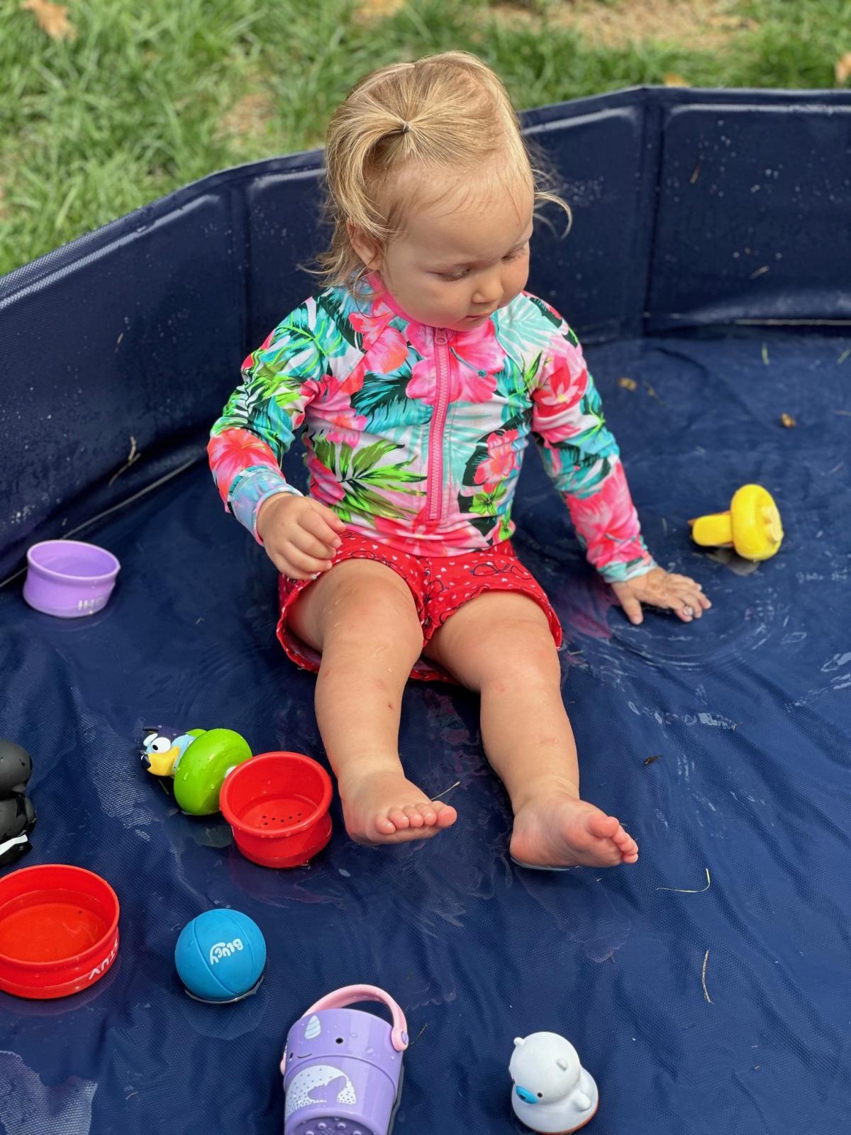 Child playing in pool during Water Play