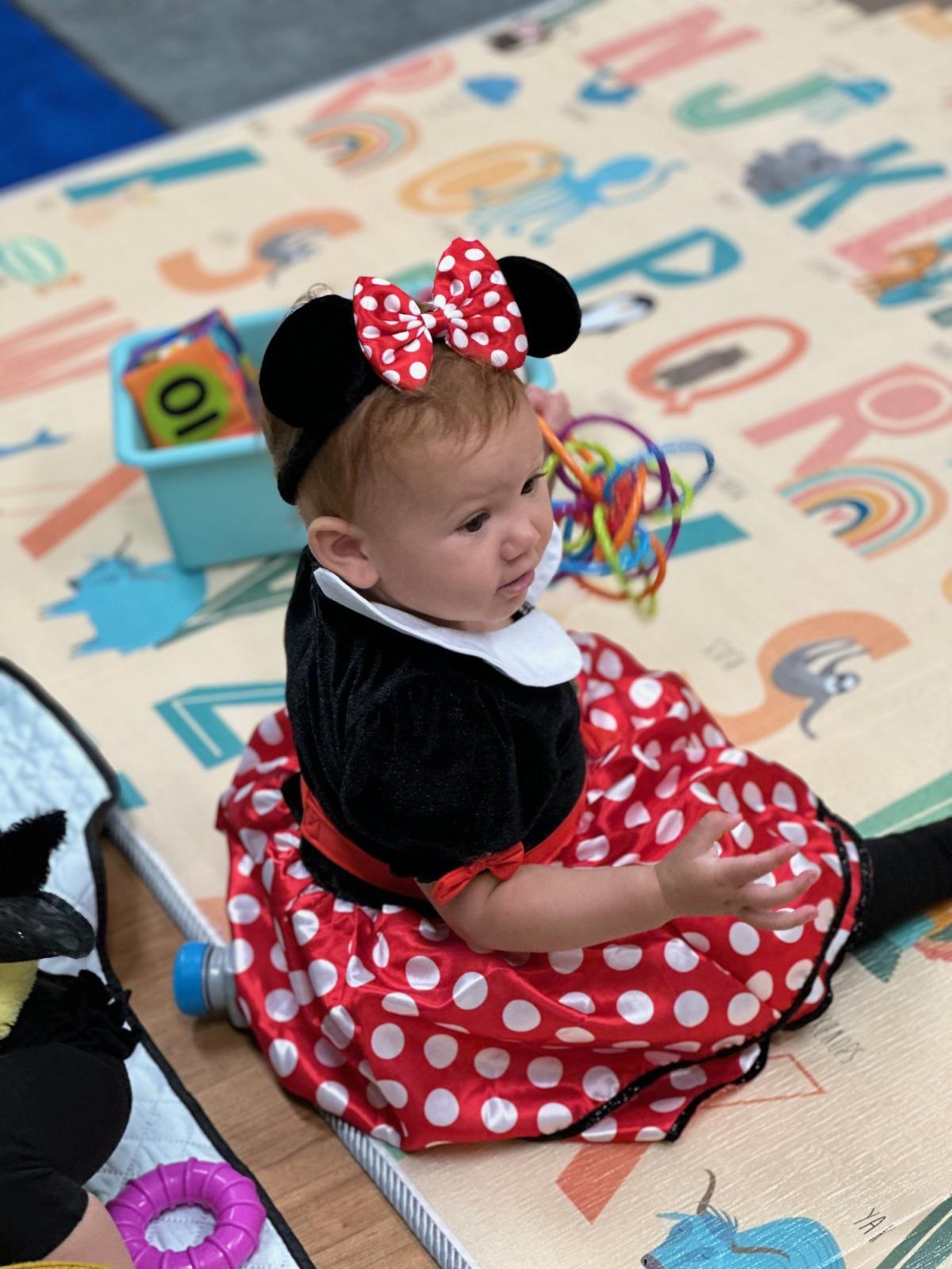 Child wearing minnie mouse costume