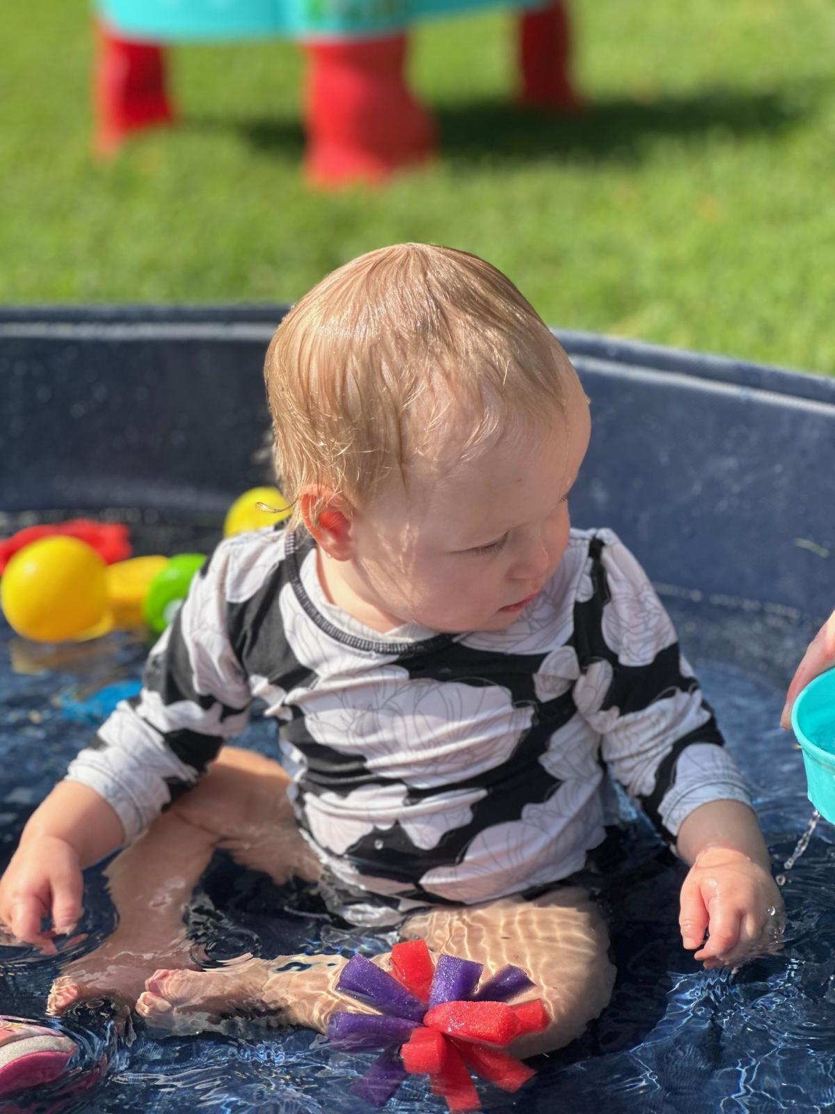 Baby playing in pool